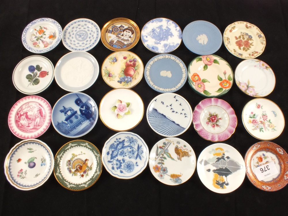 A collection of miniature plates by various makers