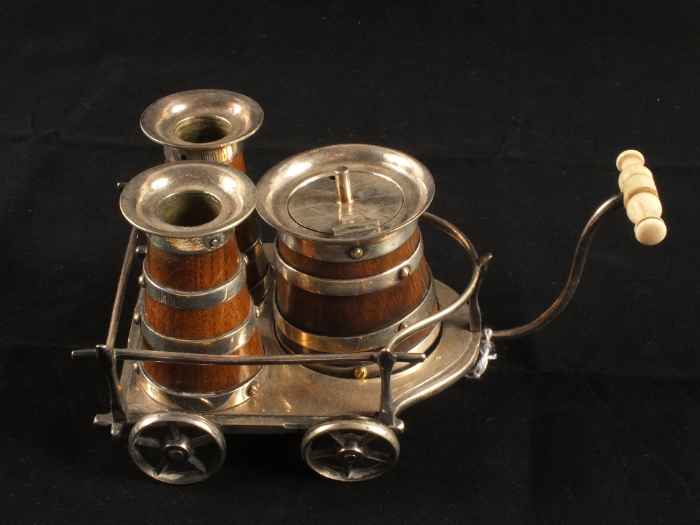 An Oak and Silver plated cruet set on tray in the form of a milk cart with Ivory handle with