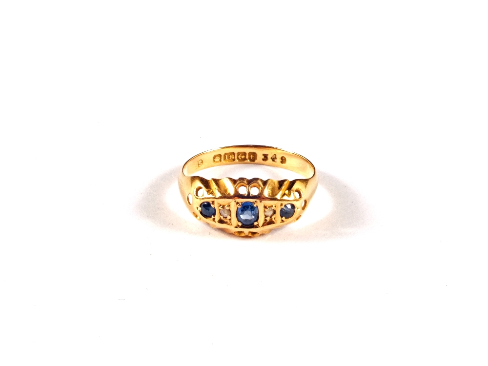 An 18ct gold Sapphire and two small Diamond ring, size N
