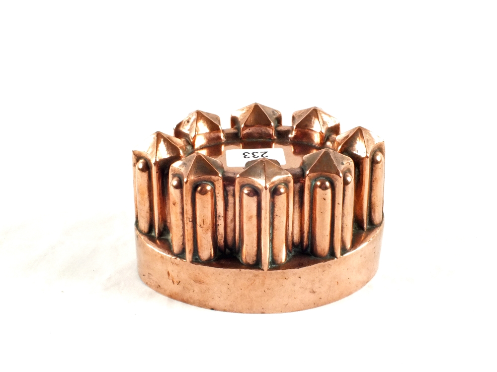 A Victorian oval copper jelly mould of turret form by Benham & Froud, 7" wide