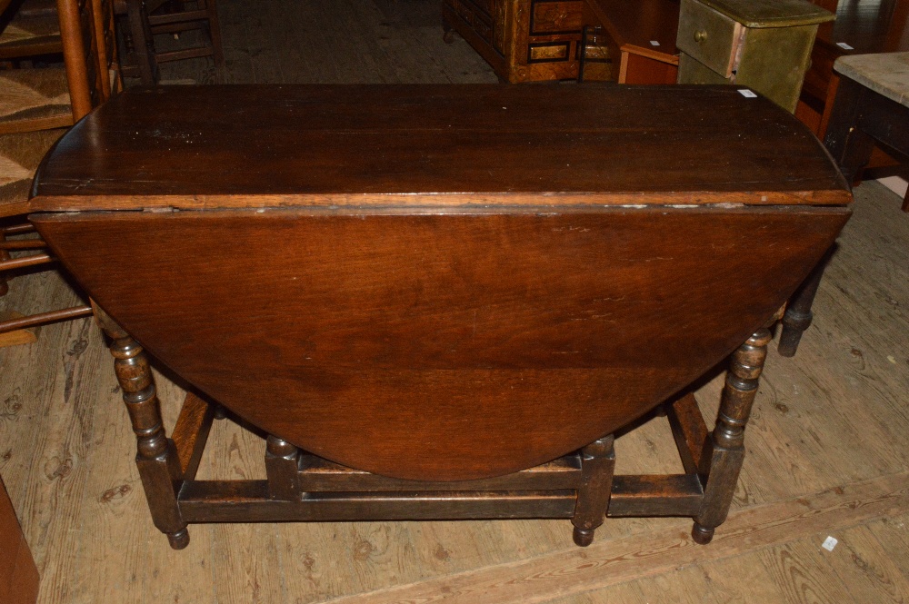 A large Oak circular gateleg table