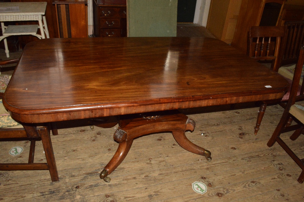 A large Mahogany flap leaf breakfast table