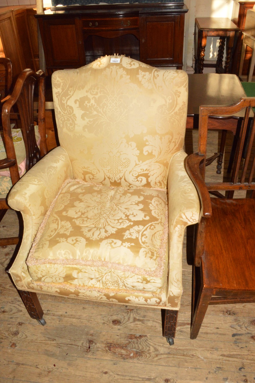 A yellow upholstered armchair