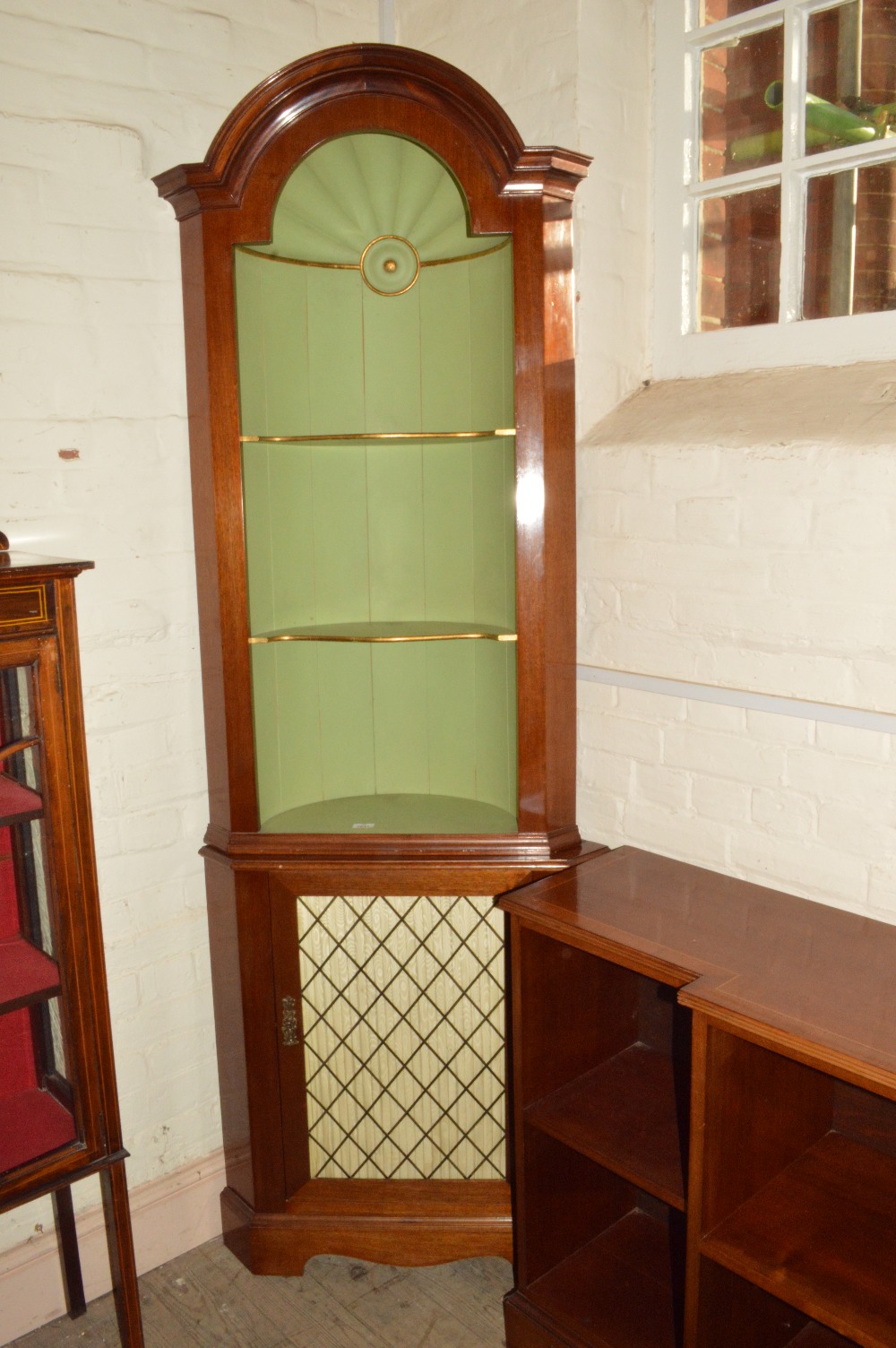 A Mahogany floor standing corner cupboard with open shelves