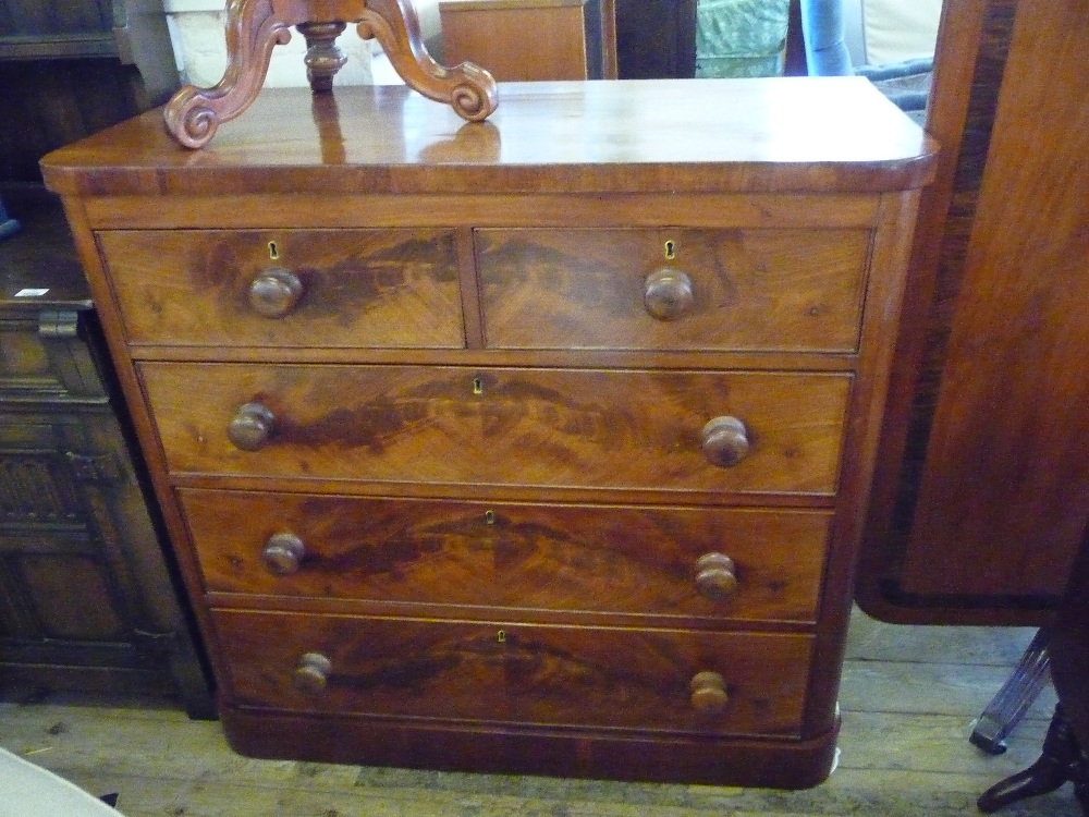 A Mahogany chest of two short and three long drawers and a reproduction side table