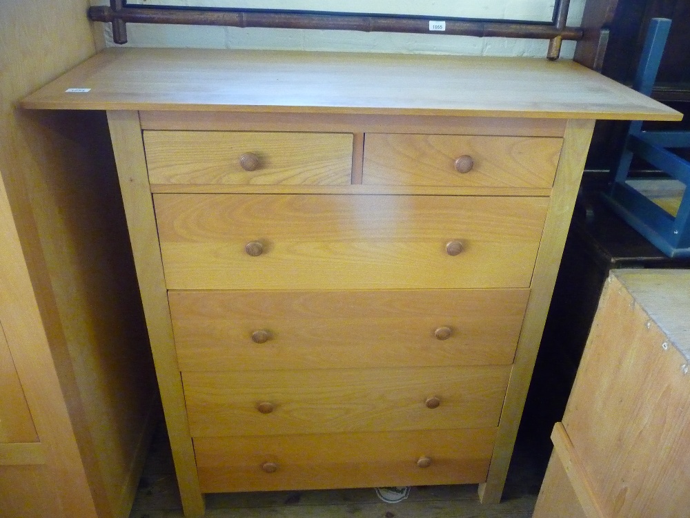 A light Oak six drawer chest of drawers