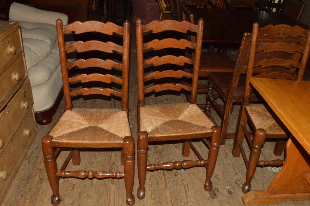 Six rush seated ladderback chairs