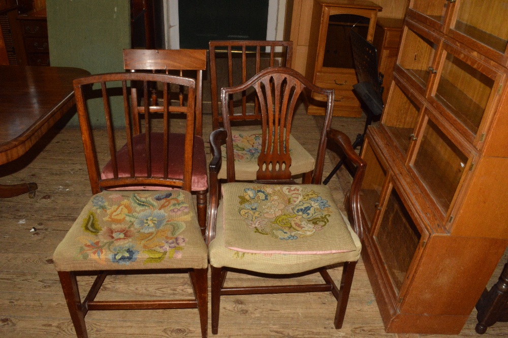 A harlequin set of country chairs (three of which are carvers)