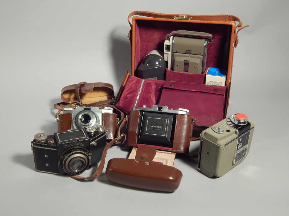 Various cameras etc., to include an early Exakta camera, a Zeiss Icon camera, a Eumig cine camera, a