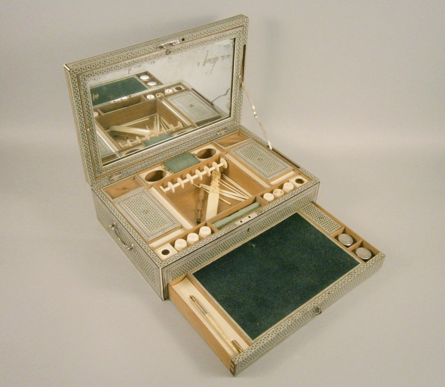 A late 19thC Indian Vizagapatam dressing case, veneered with a mosaic of ivory, wood, tin and