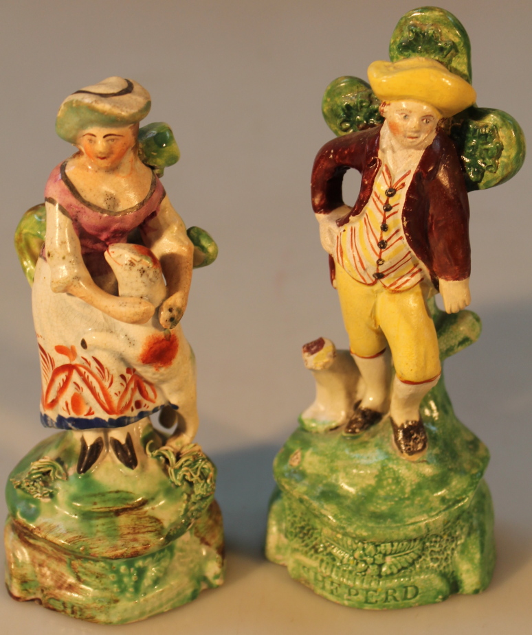 A pair of early 19thC Staffordshire creamware figures, by Ralph Salt, of a shepherd and