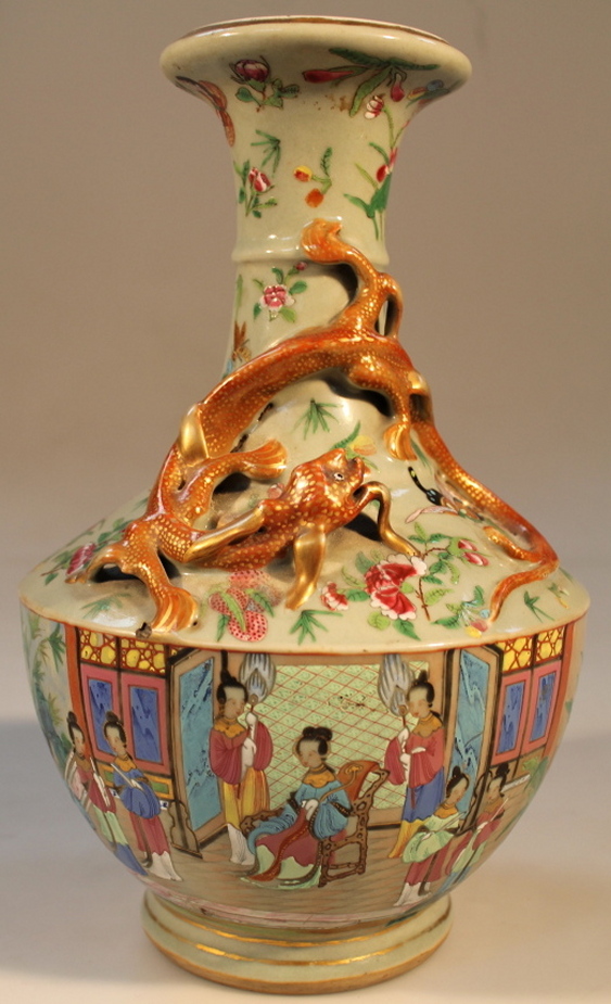 A Cantonese vase, of trumpet form with an entwined dragon handle the bulbous body decorated with a