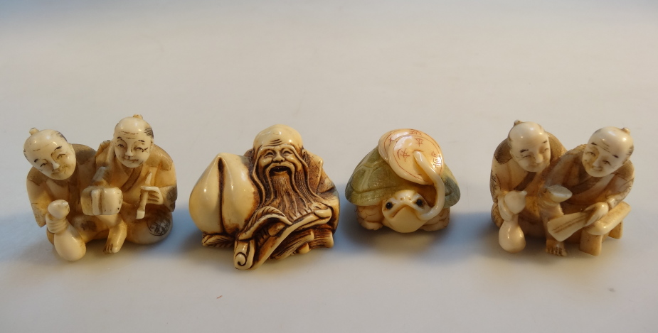 Four various Japanese netsuke, comprising two similar figures of gentlemen and a seated hotei,