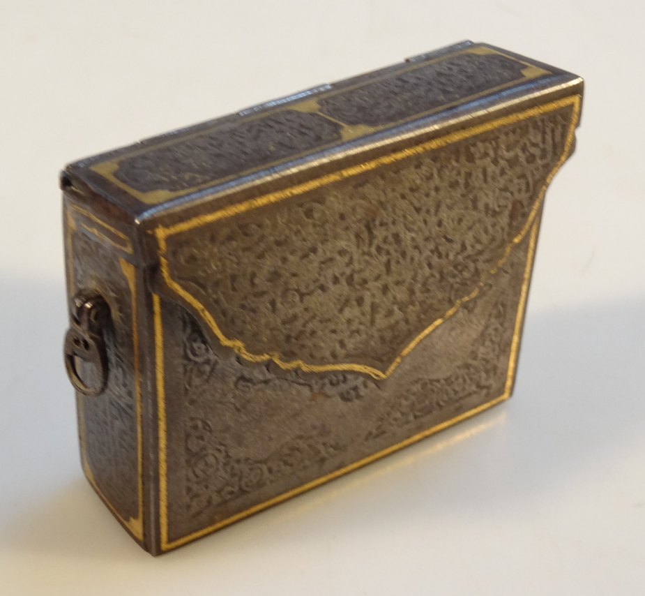 A 19thC white metal box, of rectangular satchel form, the shaped lid revealing a plain interior