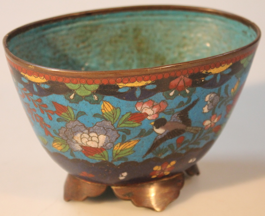A 19thC Chinese cloisonne bowl, of oval form decorated with birds and flowers, in blue, green,