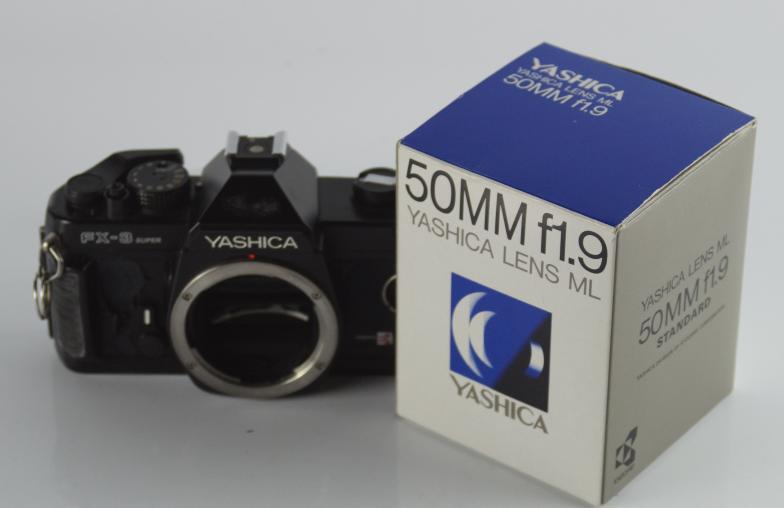 A Yashica FX-3 super SLR camera, with 50mm lens and case.