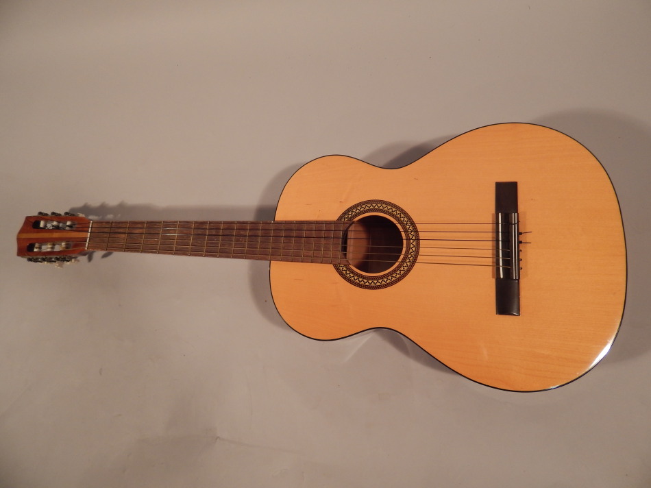 An acoustic guitar, with maple finish body and Tunbridge style transferred inlay, with bone finish