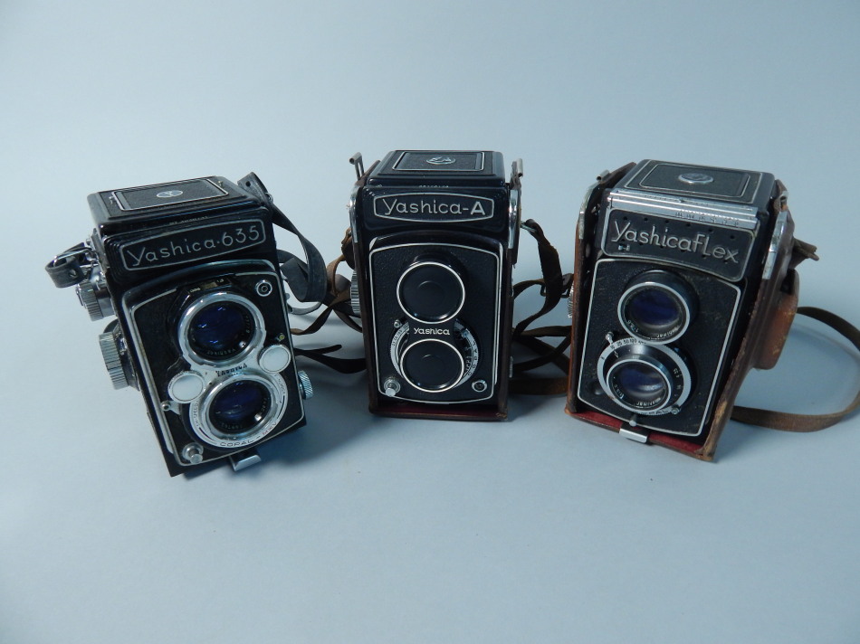 A Yashica 635 camera and two others.