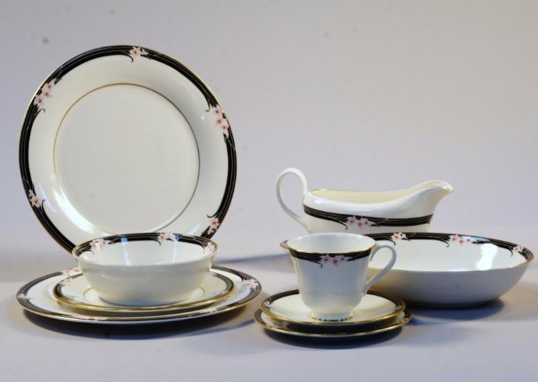 A Royal Doulton Enchantment dinner service, comprising serving bowl, dinner plates, side plates,