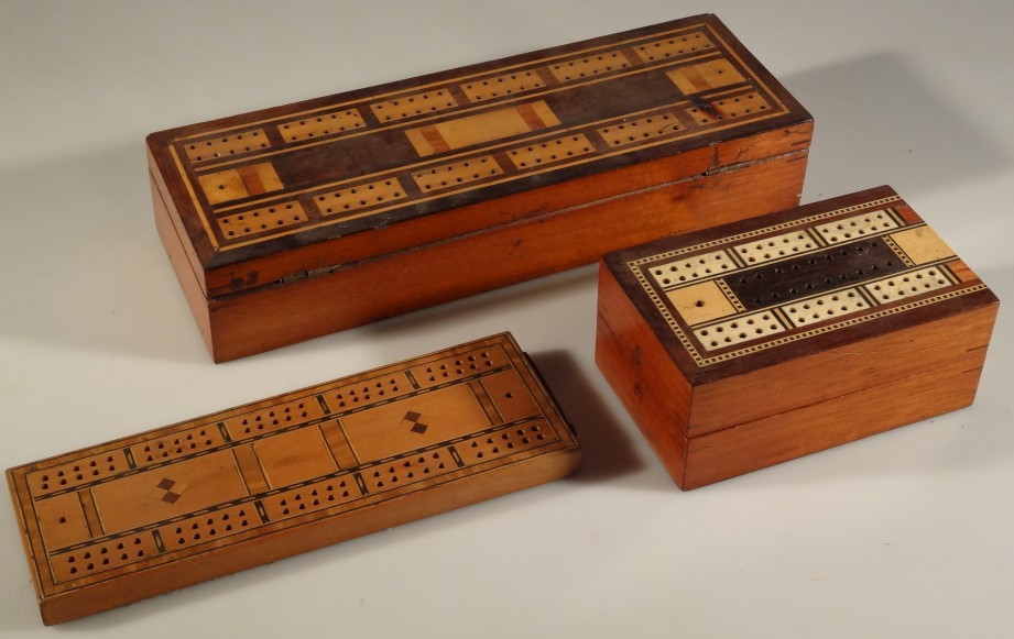 Two folding inlaid cribbage boards and another.