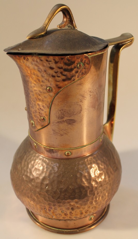 An early 20thC Arts and Crafts electric copper jug. Manufactured by The British Thomson-Houston