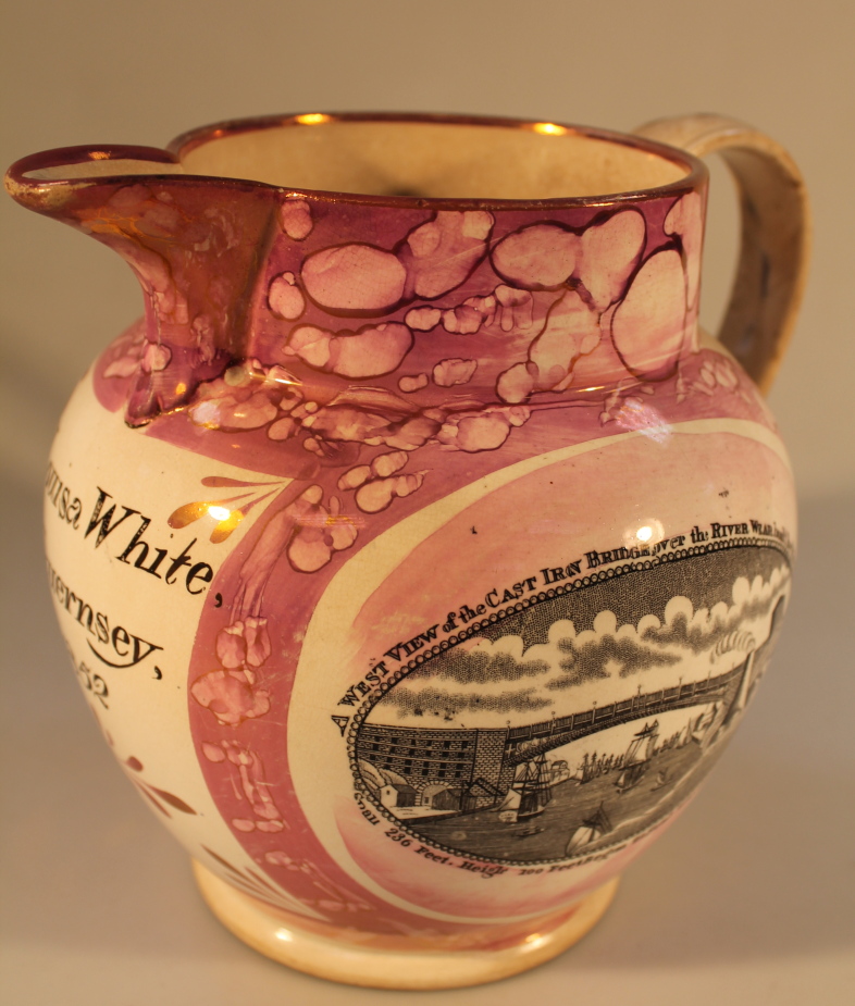 A 19thC commemorative Sunderland lustre jug, transfer printed in black with a view of the Cast