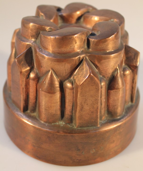 A Victorian circular copper jelly mould, 12.5cm diameter.