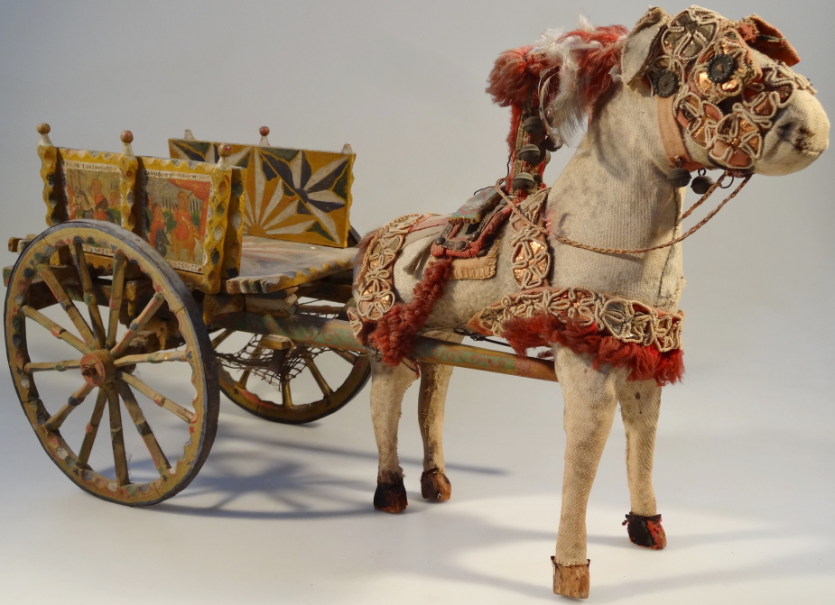 A late 19th/early 20thC Italian painted model donkey cart and donkey, the cart with painted panels