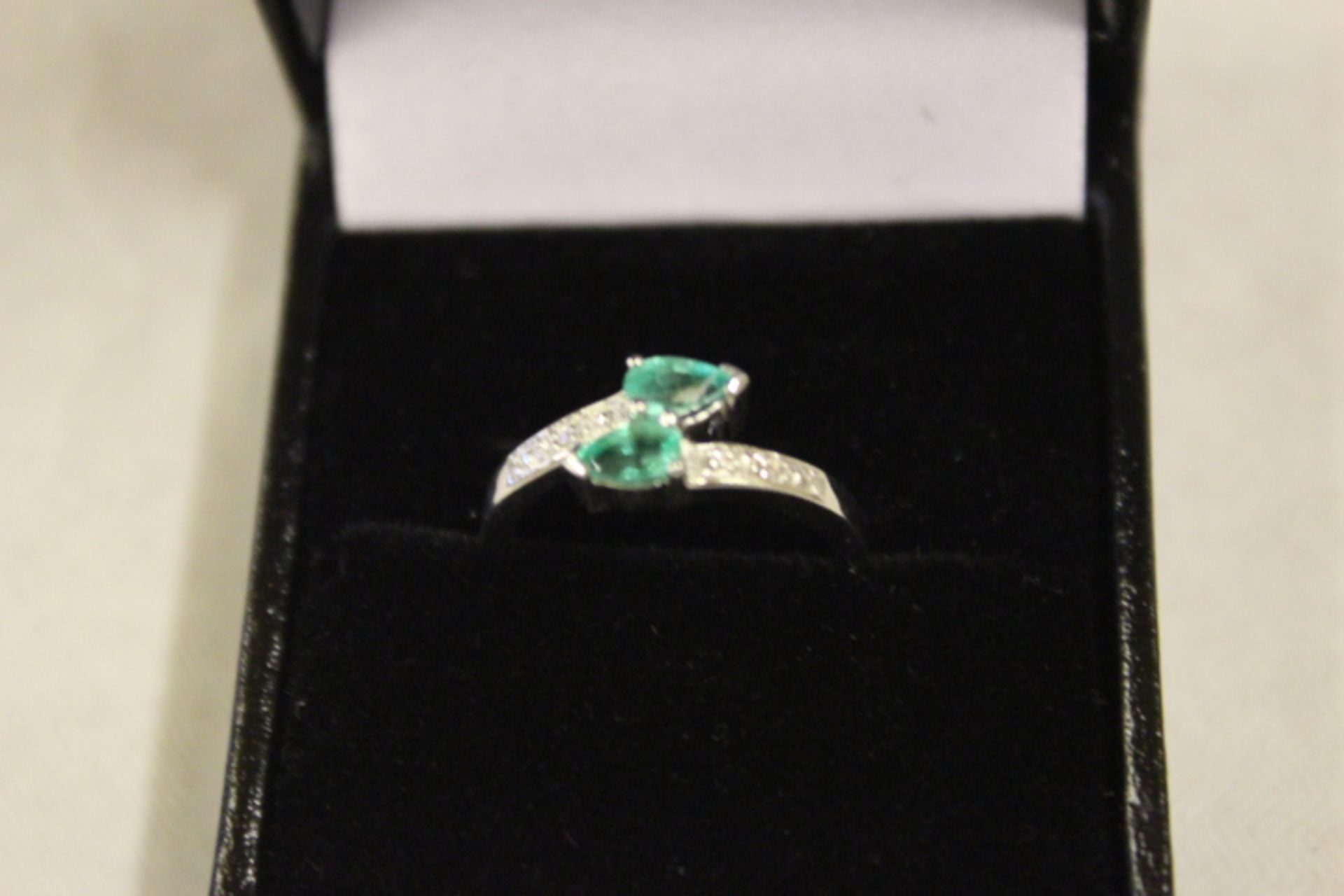 Ladies WM Diamond & Two Emerald Crossover Ring