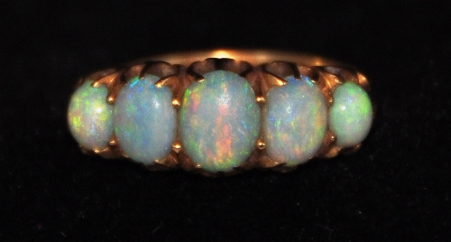 Gold ring with 5 opals