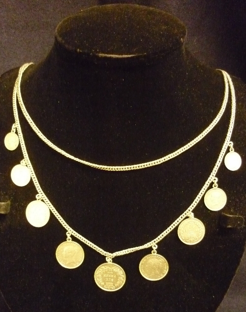 Silver coloured necklace with Maundy money, 1 sixpence, 2 four pence, 2 three pence, 2 two pence &