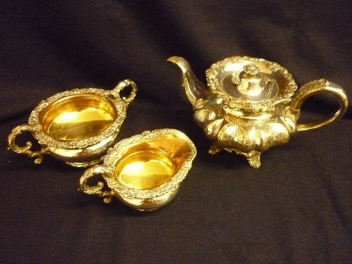 Silver plated teapot with engraved bulbous body, silver plated sugar bowl with gilt interior &