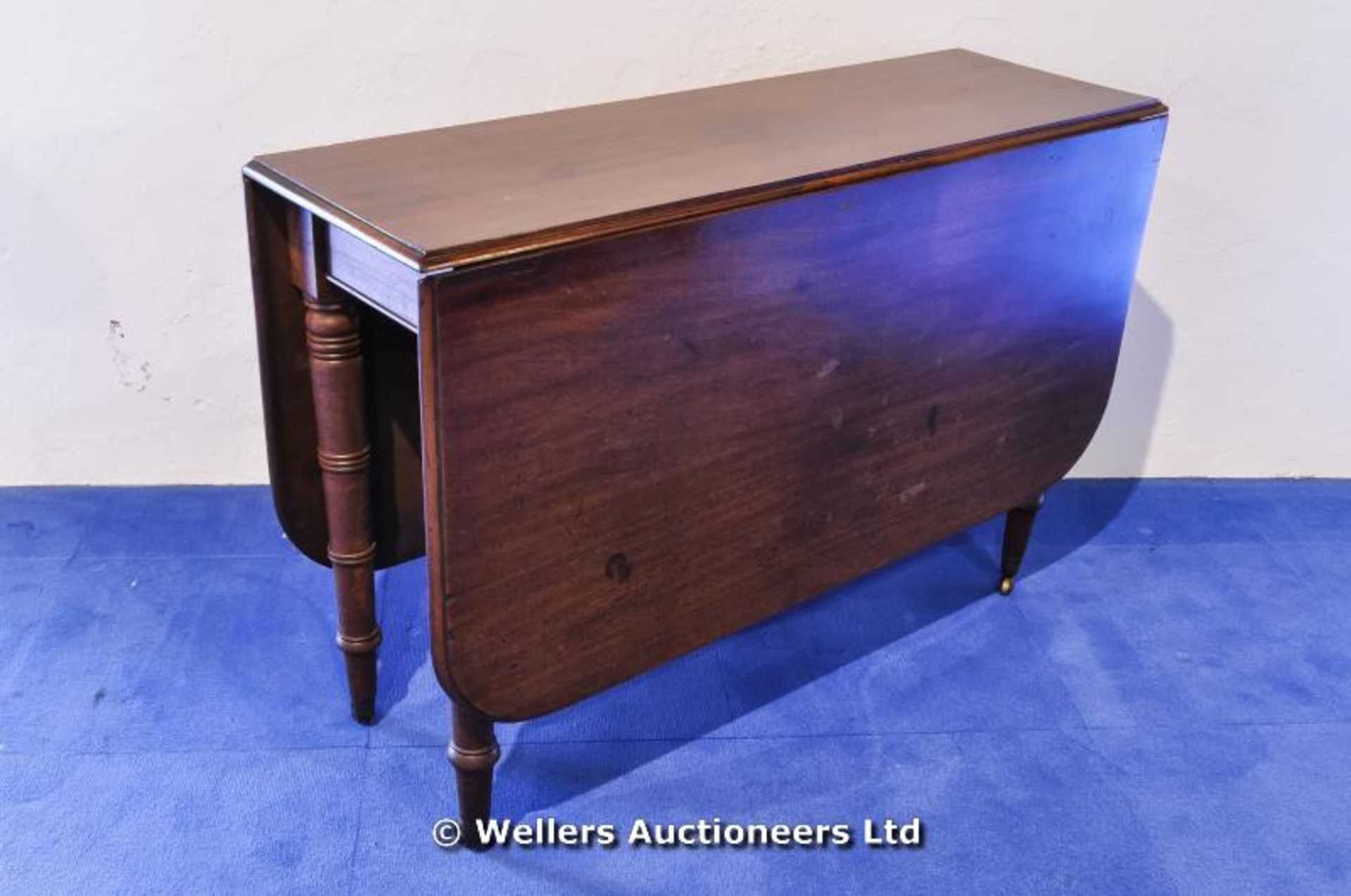 A Victorian mahogany drop flap dining table