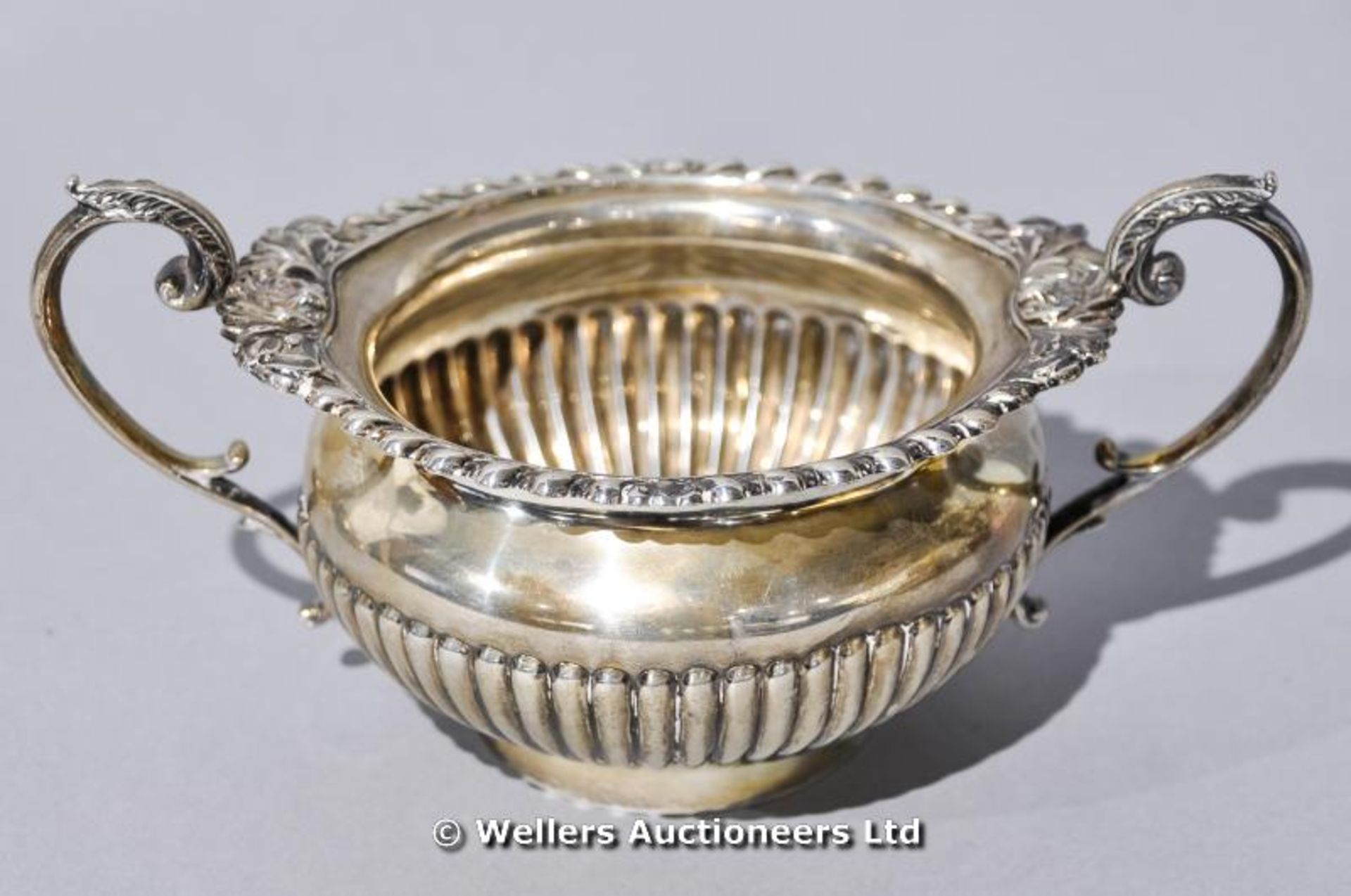 A silver two handled sugar bowl, London 1901, 355 gms