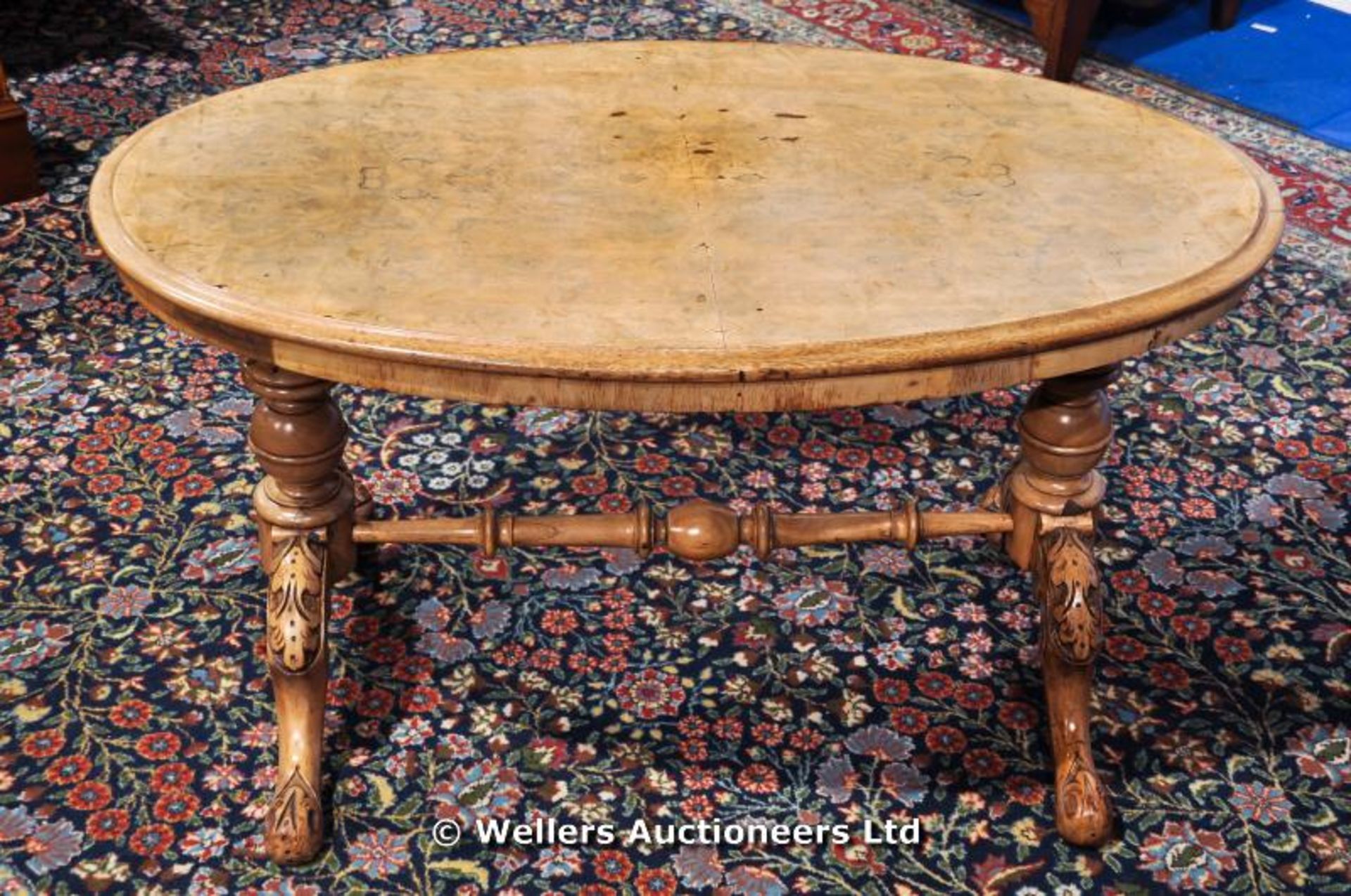 An oval coffee table on ornate H frame support, C1850