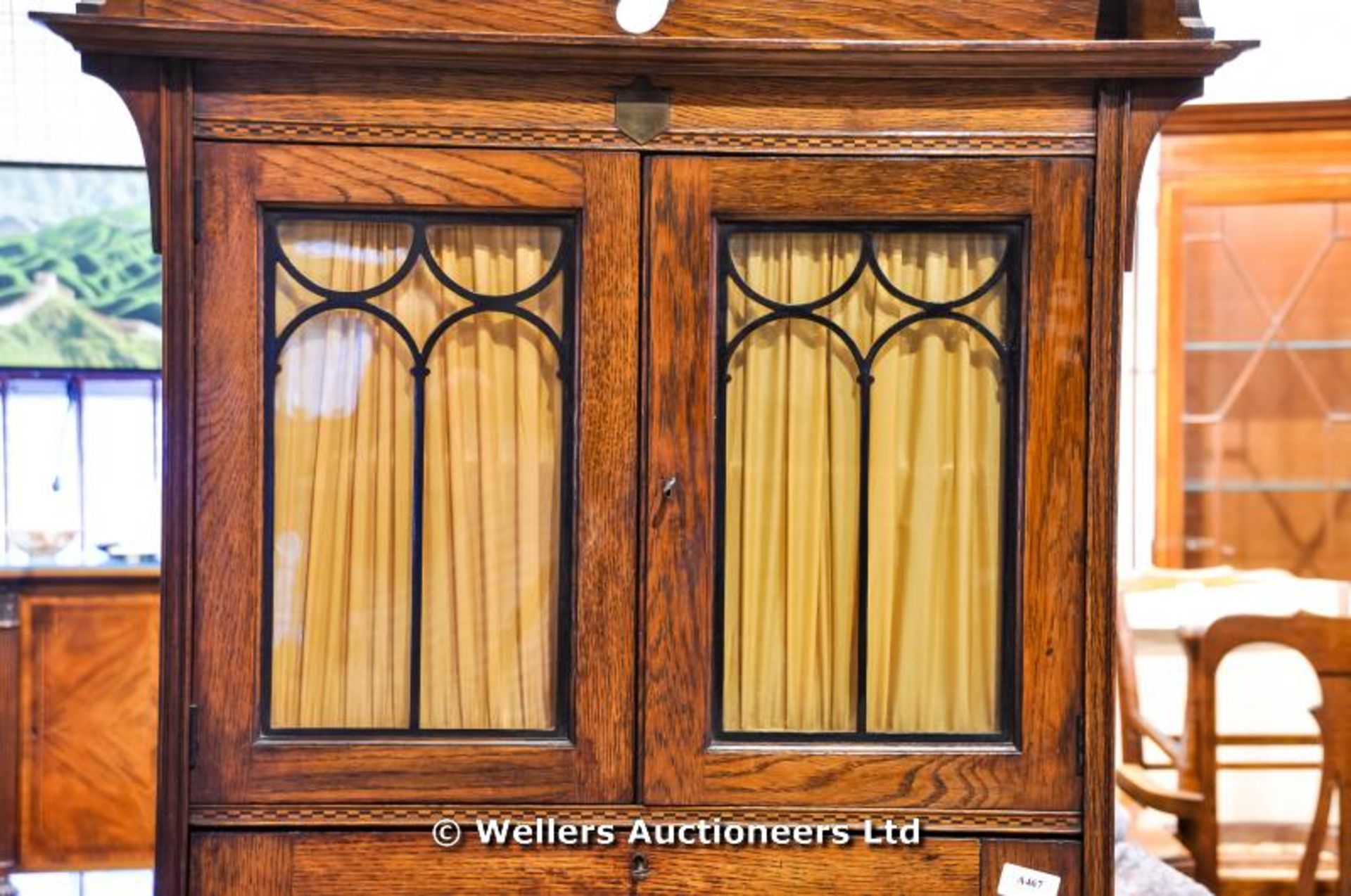 An Arts & Crafts oak bureau bookcase with curtained and glazed upper cupboard, above fully fitted - Image 2 of 4