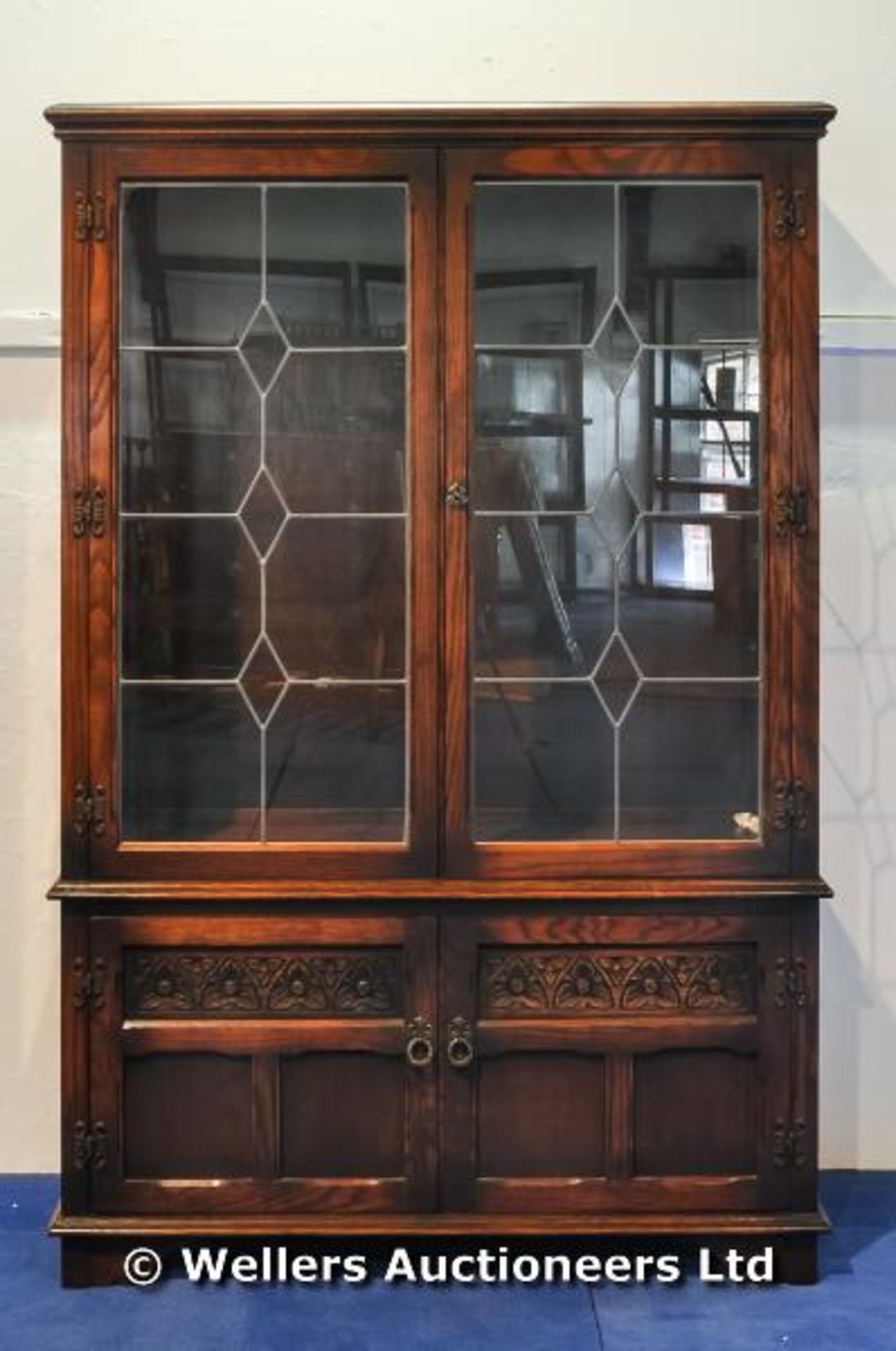 A leaded light glass display cabinet, two doors opening to reveal three glass shelves, cupboard