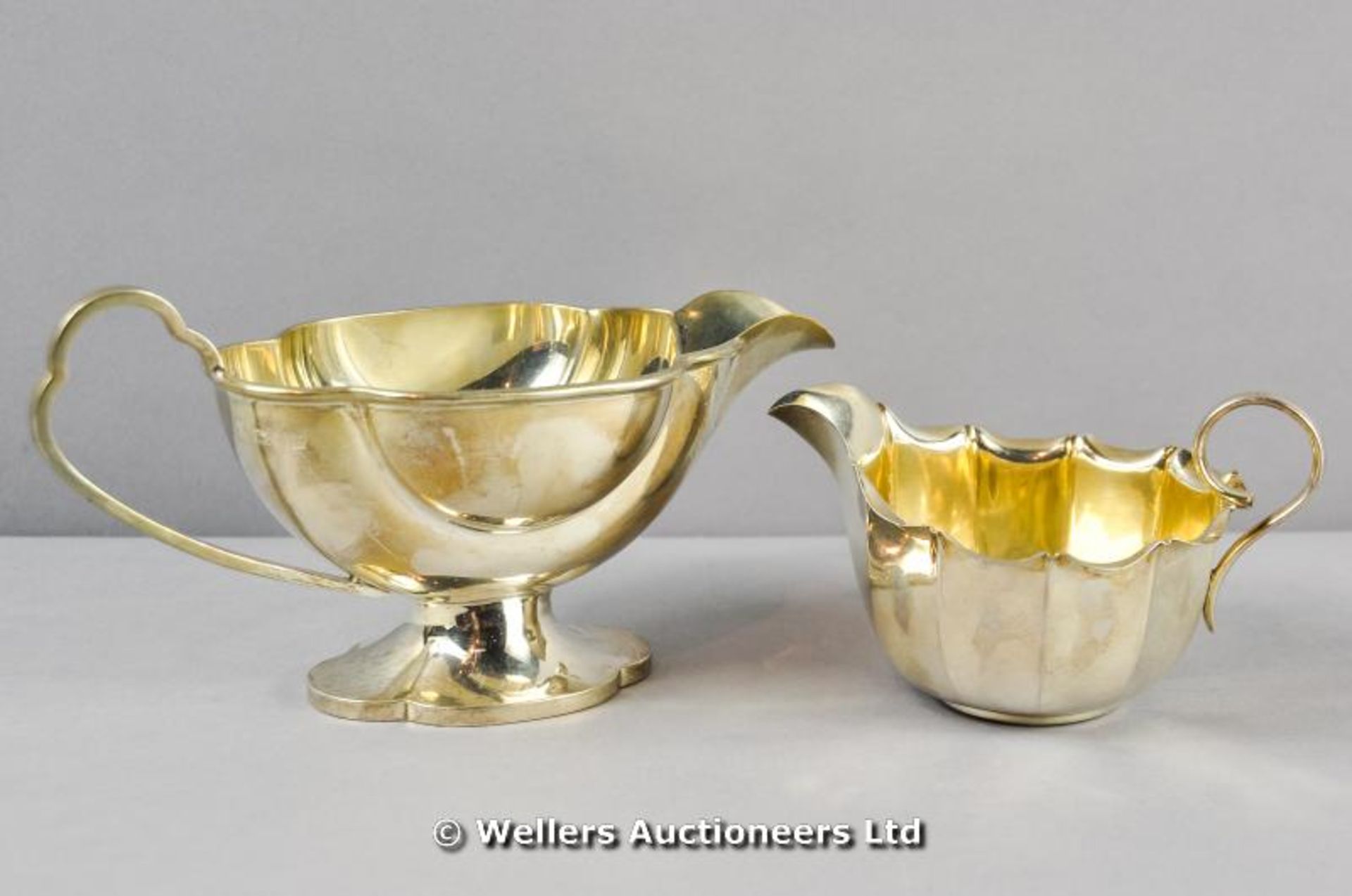 *An Art Deco silver sauce boat, London 1933, and a Victorian silver cream jug, Sheffield 1895, total