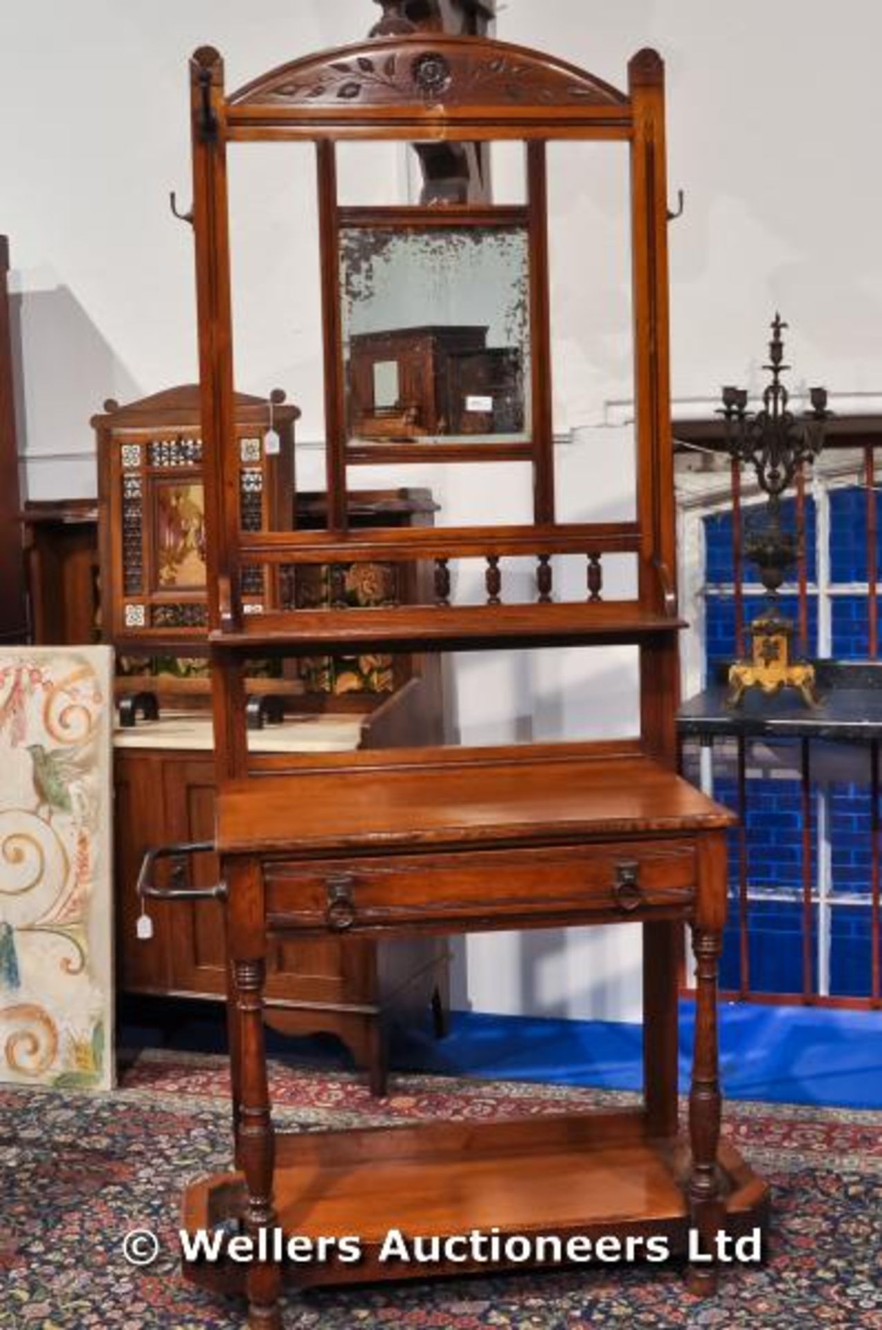 An oak hall stand, with original mirror plate, a single drawer and under tier, C1880