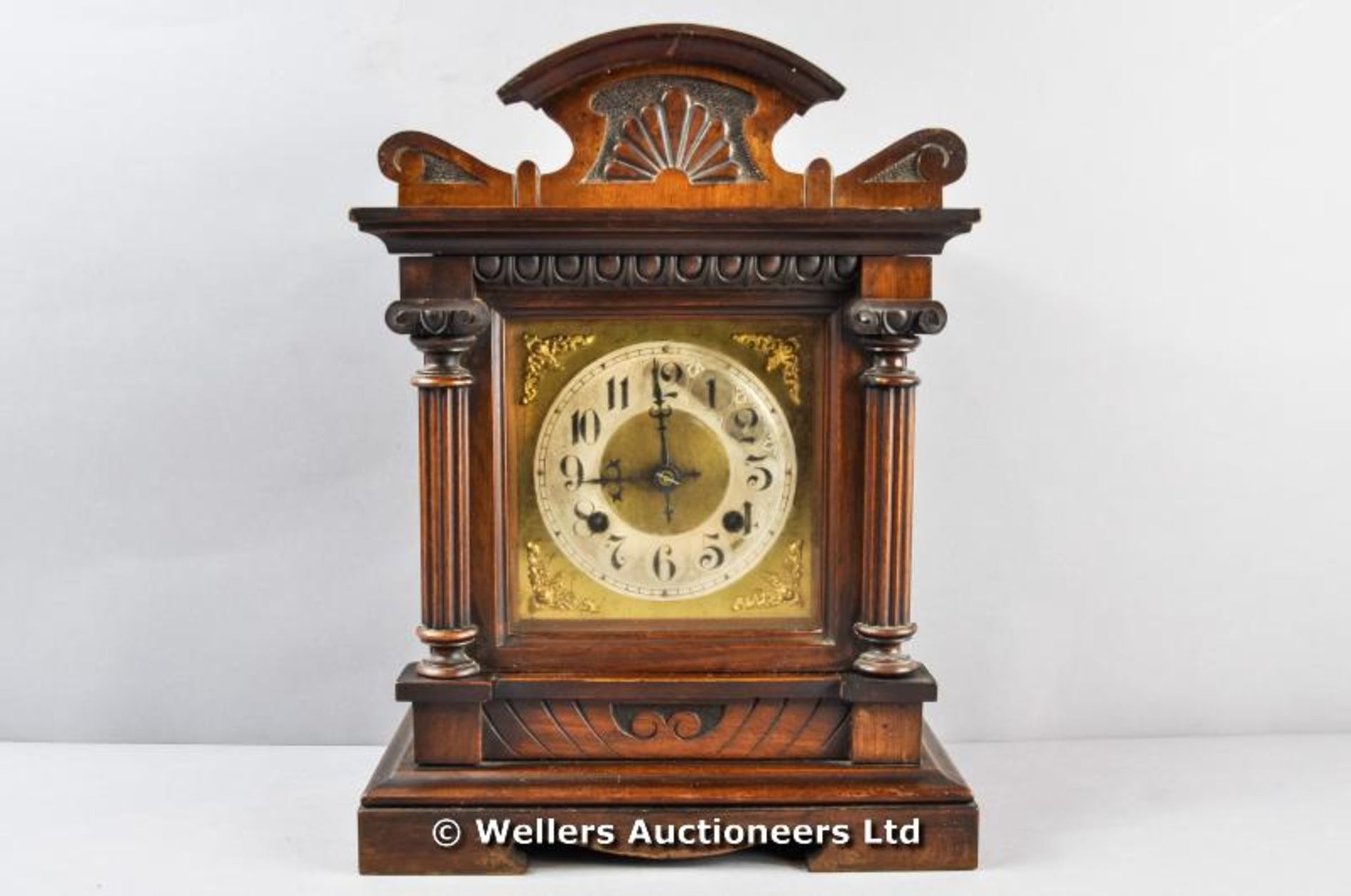 A walnut cased mantel clock, C1900