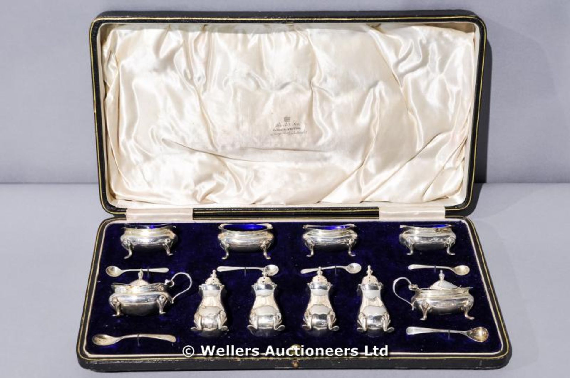 A silver cruet set in the original retailers box, Brock and Sons, Edinburgh, inc. 4 x salts, 4 x