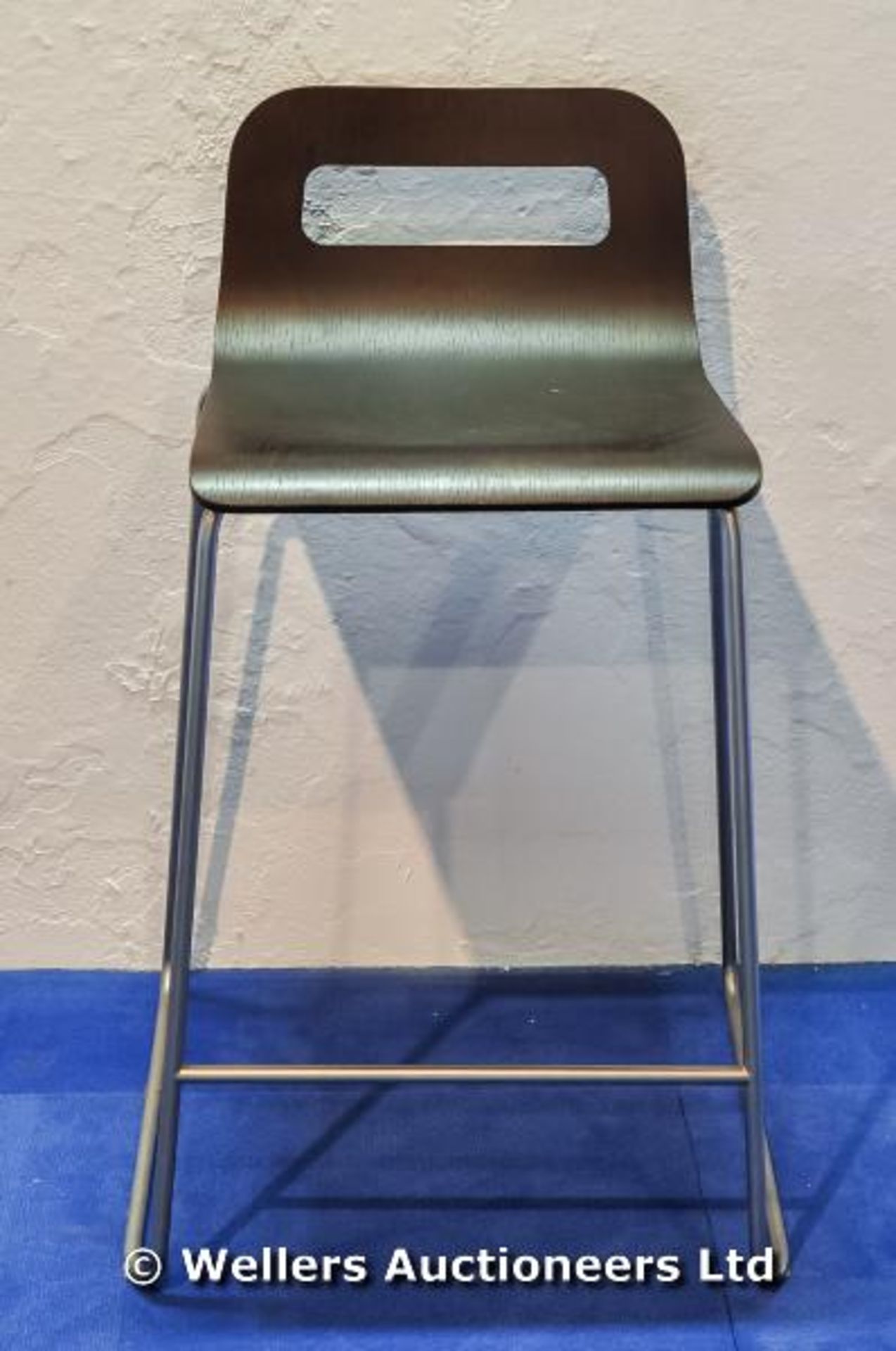 A `La Palma` Italian designer bar stool with metal frame and shaped plywood seat