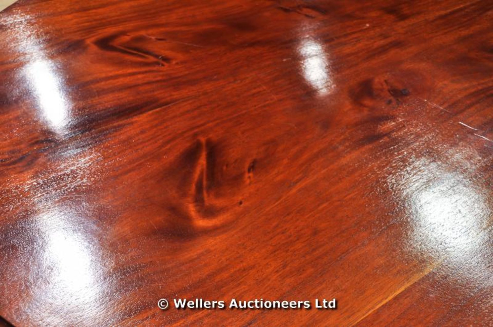 A mahogany tilt top table sitting on turned pedestal with carved tripod legs and original castors, - Image 5 of 8