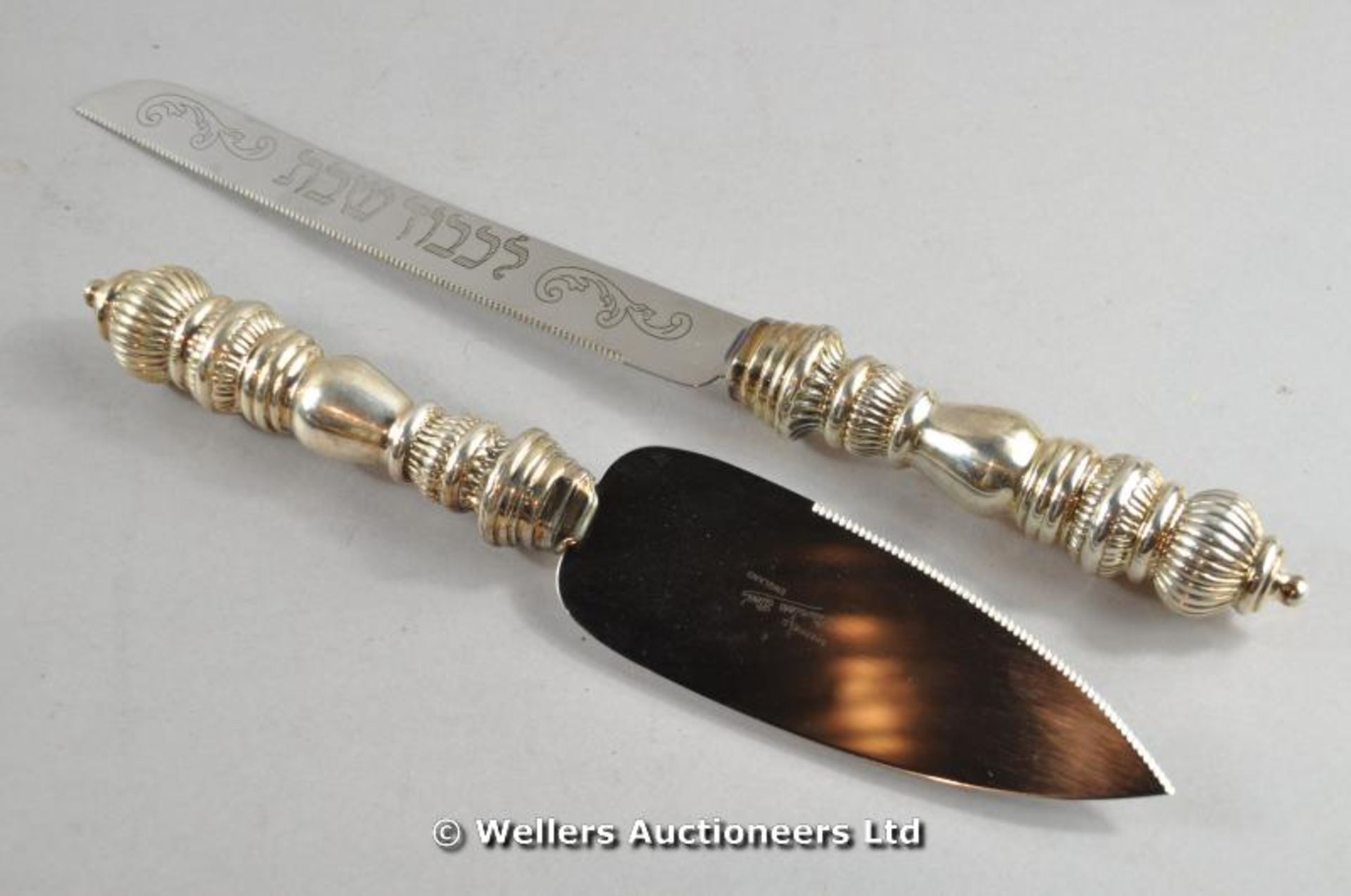 *A silver handled bread knife and a matching cake slice (Lot subject to VAT)