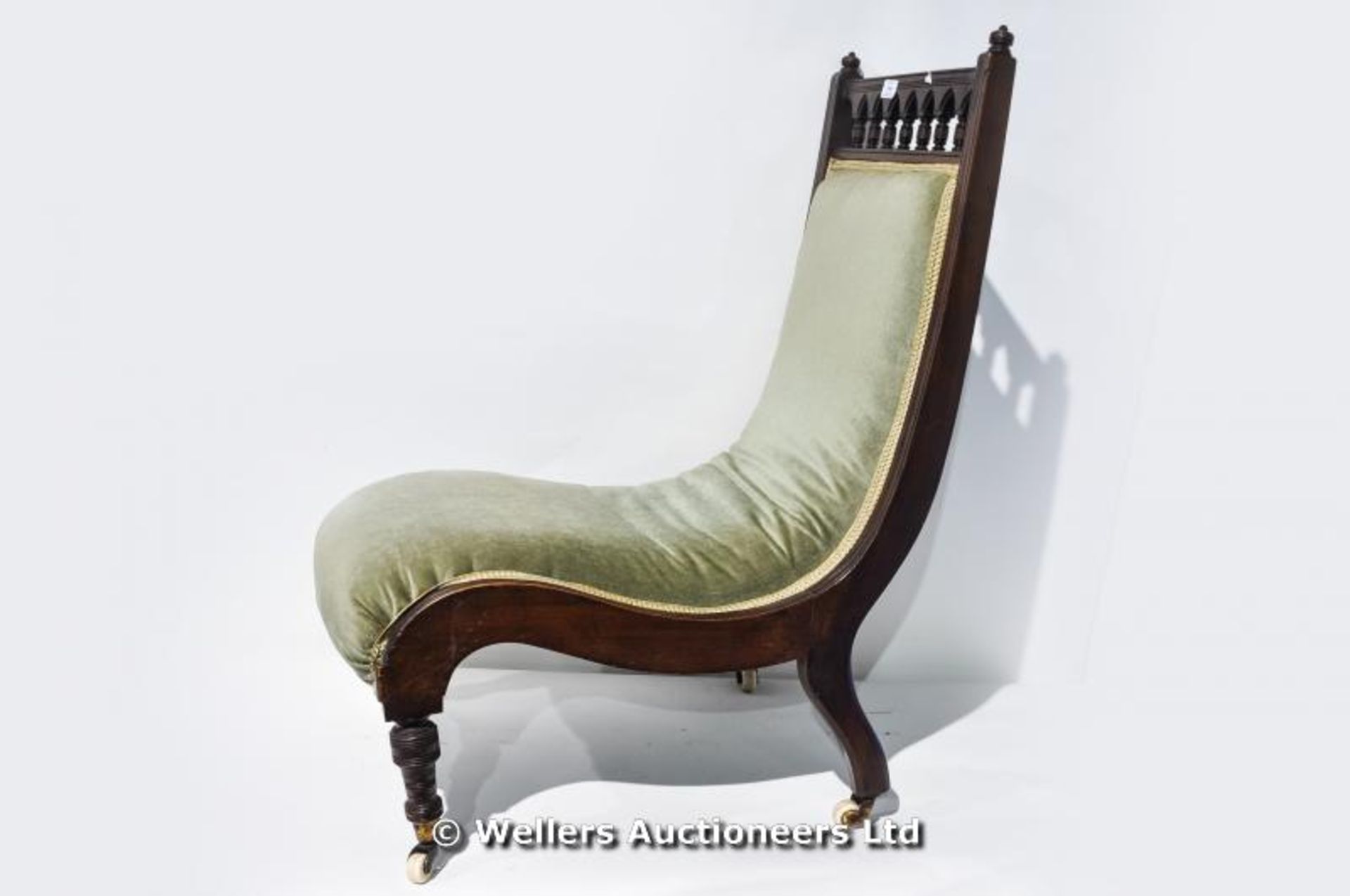 An Edwardian velour upholstered slipper chair