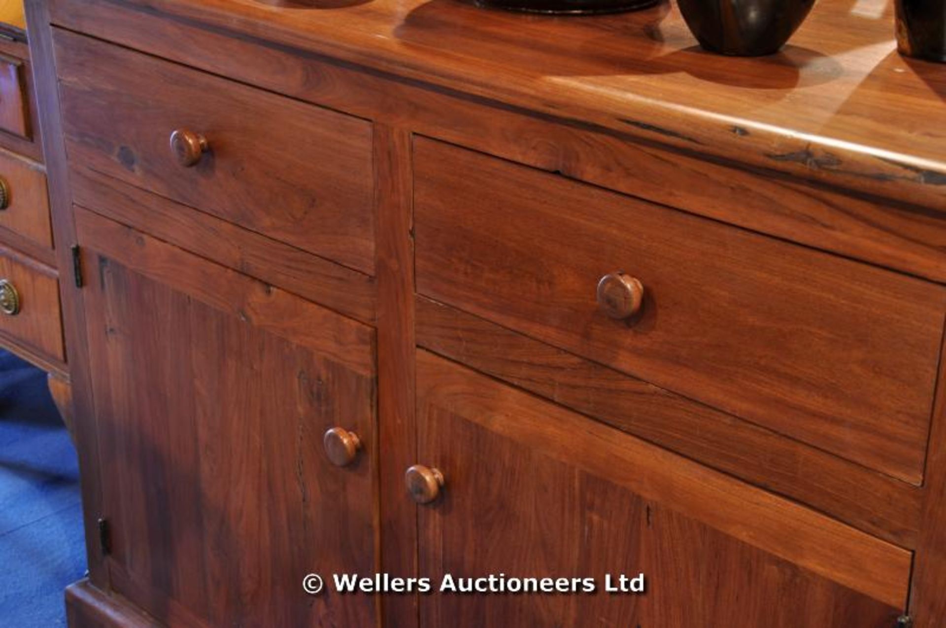 An African Teak sideboard, two drawers over a twin door cupboard - Image 2 of 4