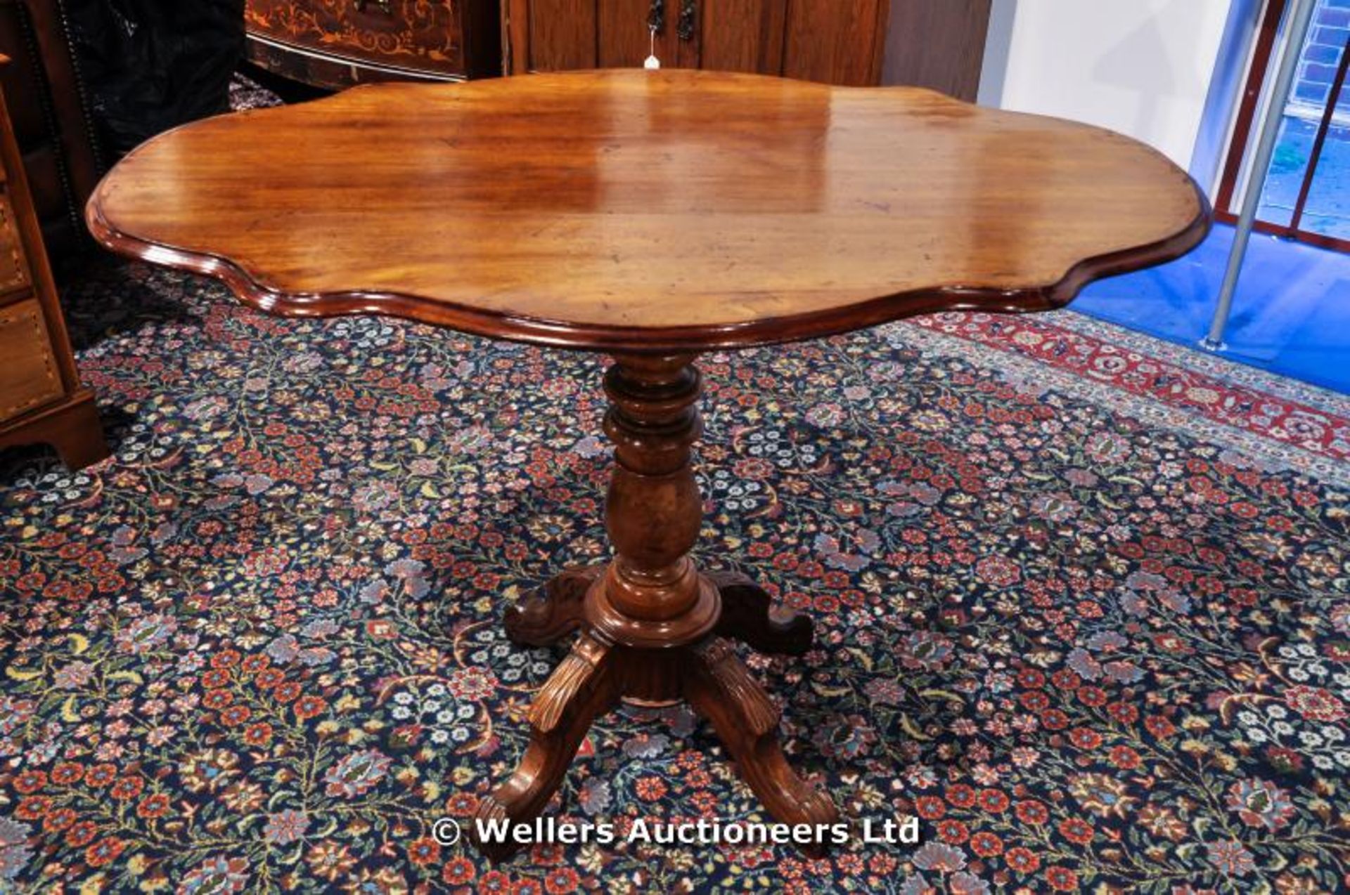 Mahogany tilt top table with a four legged turned centre support, C1850