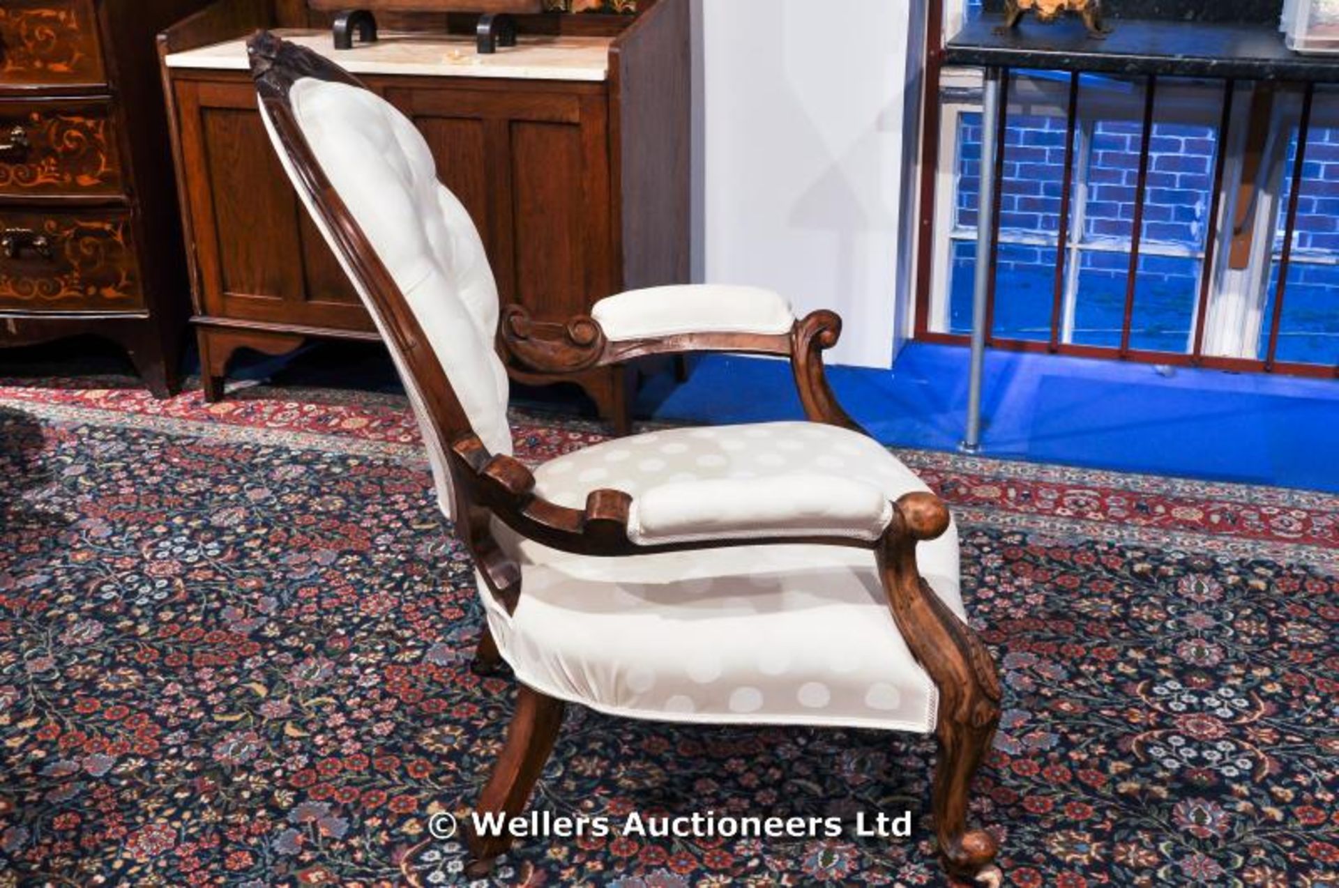 A Victorian button back salon chair with carved legs and frame on original castors - Image 3 of 7