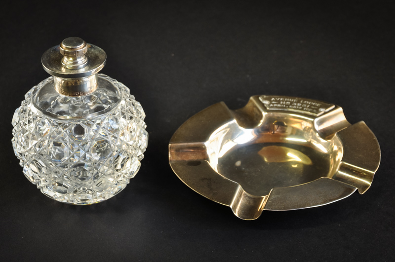 A silver topped cut glass perfume bottle, globular shape, London, 1902; and a silver Masonic