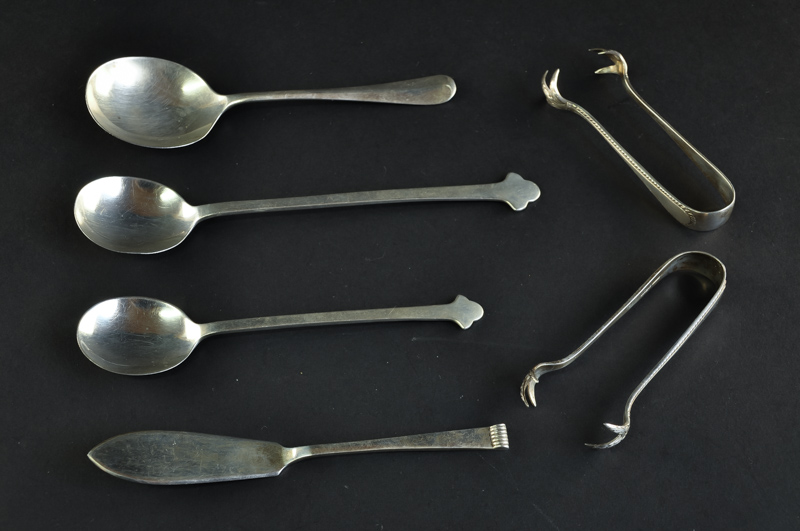 A small quantity of silver spoons; and a pair of sugar nips, Sheffield, by Cooper Bros, 93grs